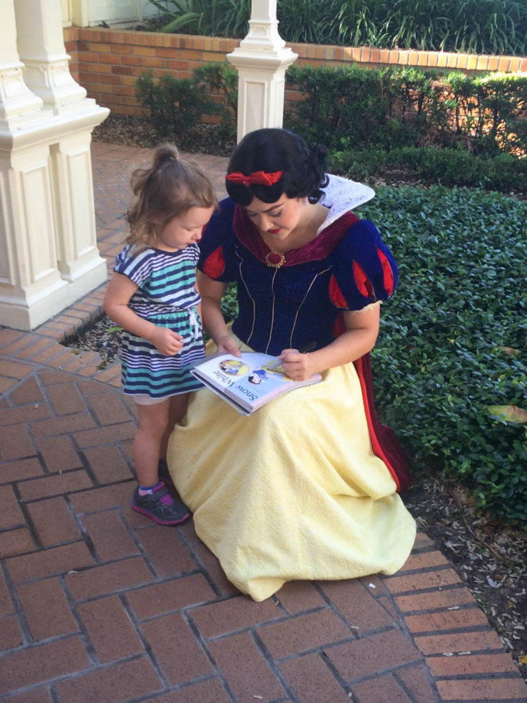 Snow White Signing Autographs at Magic Kingdom in Disney World - Tips for Amazing Character Interactions at Walt Disney World - Dream Plan Fly